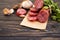 Sausage  , gastron delicatessen appetizer    bratwurst foodstuff protein on Ð´ÐµÑ€ÐµÐ²ÑÐ½Ð½Ð¾Ð¼ background sliced gourmet